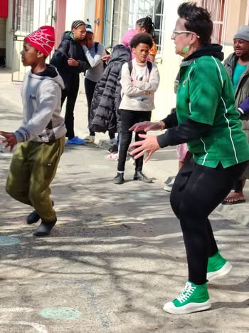 May be an image of 5 people, people dancing and street
